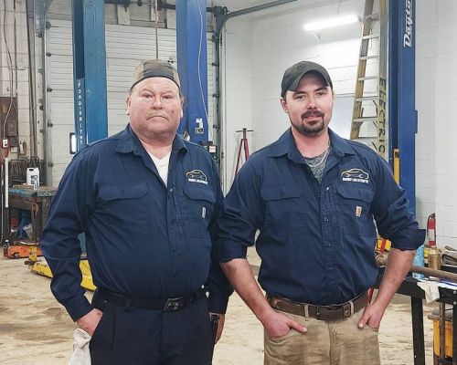 Mechanic Muril Kennedy and Zachary Woodcock, owner of Sharbot Lake Automotive.