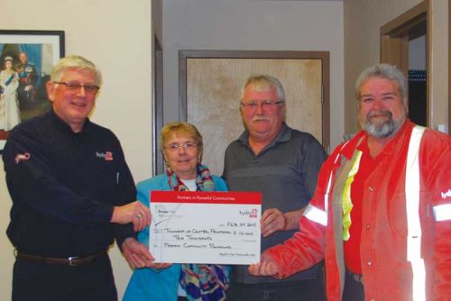 (L to R) Jon Roberts from Hydro One; Mayor Frances Smith; Bob Teal of the Hinchinbrooke Rec. Committee; and Barrie Stanbury from Hydro One posing with a ceremonial $10,000 Power Play Cheque at the Central Frontenac Township office on February 24.