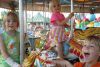 Calvin, Ezra and Cala Dark of Ottawa enjoyed a ride on the Merry-Go-Round at the 62nd annual Verona Lion&#039;s Jamboree