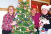 Joanne, Chrissy and Angie decorated Mike Dean&#039;s large tree, which won first place at the festival