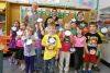 Chris Roberts from Mike Dean’s, Christine Patterson representing the food bank; Karl Kent and his Granite Ridge Education Centre grade 2 class with their &quot;Autumn Leaves&quot; for the food bank.