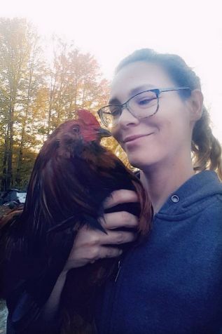 Holly Bone with one of her chickens.
