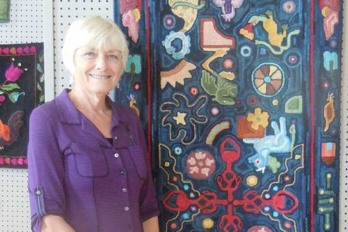 Frontenc Rug Hooker Linda Hetherington and her “Fantasy Animals” floor runner at the Grace Centre's “Textile Adventure” show in Sydenham    