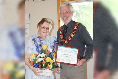 Mayor Ron Higgins made a presentation to Barb Sproule as North Frontenac’s 2017 Senior of the Year at last Friday’s Council meeting in Harlowe. Sproule, a former teacher was also a five-time Reeve of Palmerston-Canato Township and the second-ever female Warden of Frontenac County. Photo/Craig Bakay