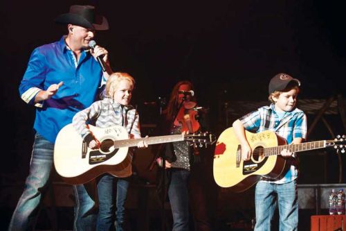 Emily and Ben Baillargeon on the K-Rock stage with Gord Bamford