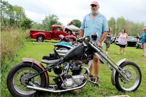 Rob Verrier with his “work in progress” Triumph at the Godfrey Social Club’s second annual Car and Bike Show Sunday. Photo/Craig Bakay