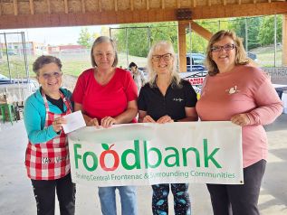 Janice Anderson accepting on behalf of the food bank and again presenting is Christine ,Penny ,and Angela on behalf of the summer Rink Market.