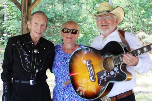 Inductees Walter Cameron, Doreen Black and Albert St. Pierre reminisce backstage before their induction into the Land O’Lakes Traditional Music Hall of Fame Saturday in Flinton. Photo/Craig Bakay