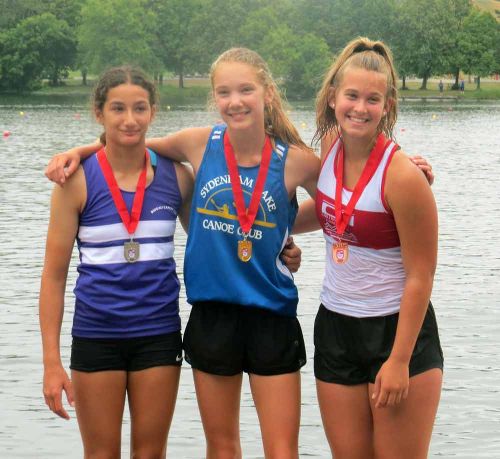 Claire Swinton (centre) won the gold medal in the K1 1000 metres at the Provincials