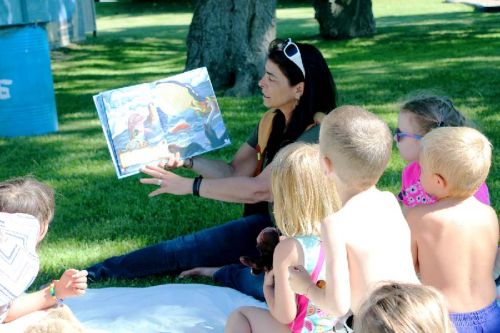 Marcie Asselstine read stories to an enthusiastic audience who participated in the story with puppets and stuffed animals. Photo/Craig Bakay