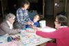 Estelle DiCinto, Nancy Miller, Daniel Miller and Patty Hallgren work on their puzzle pieces for the wall construction last Sunday as Community Living North Frontenac hosted an Autism Awareness Day at Oso Hall in Sharbot Lake. The puzzle pieces represent how many different aspects there seem to be to autism. Photo/ Craig Bakay 