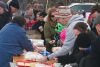 Lining up for free burgers and dogs for Family Day at arena