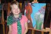 LOLPS Art Club member Charlotte Hilder with her finished painting titled “Lola in the Flowers”