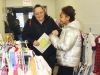 Adi Sweet Okechukwu gets mom Ruth Sweet’s approval on some treasure she found at the Hartington Community Caring Christmas Open House Sunday in Hartington. Photo/Craig Bakay