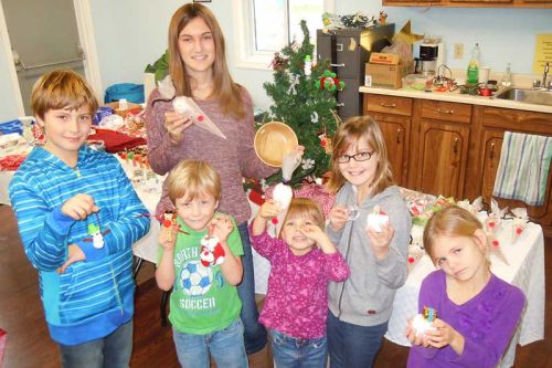 L-r youngsters from St. Paul's Sunday school in Harrowsmith, Matthew, Jared, Blaire, Eve, Tess and (in the back) Erin helped out at St. Paul's Country Craft Sale on November 14