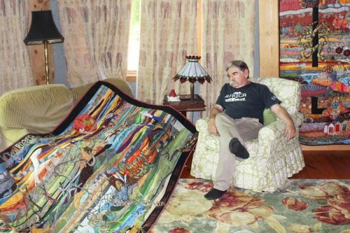 Ihor Gawdan in his ‘great room’ with his two latest art quilt creations. Photo/Craig Bakay