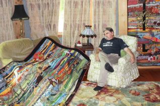 Ihor Gawdan in his ‘great room’ with his two latest art quilt creations. Photo/Craig Bakay