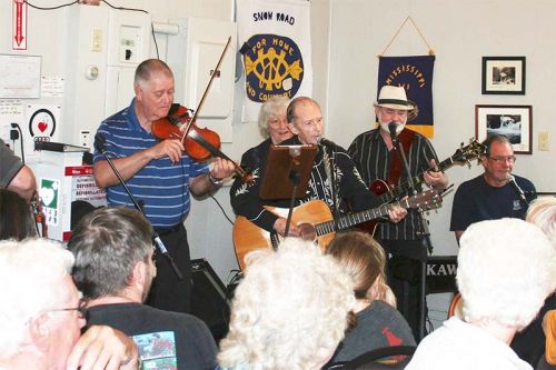 The band (Mark Hannah, Eric Labelle, Walter Cameron, Marlyn Schlievert, Eddie Ashton and Kevin Topping) entertained a packed house as Snow Road Station celebrated the official opening of its former schoolhouse into a community centre last Saturday. Photo/Craig Bakay