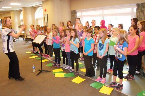 Jennifer Guild led the 38 member Elginburg Public School choir who performed at the Fairmount home in Glenburnie on May 14.