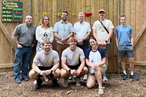 MPP John Jordan and RKY Camp Director D'Arcy Munn with staff members at the Climbing Wall