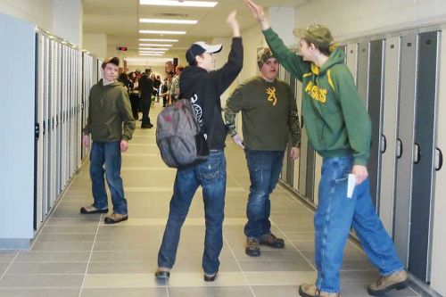 Students celebrating their new school, or something else, on the first full day of classes at Granite Ridge Education Centre on Tuesday.