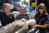 Frontenac County paramedics l-r, Paul Kalnins, Derek MacGillivray, Tamara DeVries with “Sim Man” at the North Frontenac Essential Services Fair in Cloyne