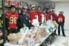 The leaders of the Sydenham High School football teams volunteered their time to help the Sydenham Rural Visions Food Bank on Saturday in the Sydenham parade. They collected over 70 bags of food, 413 lbs, cash and turkey bucks.