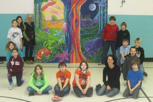 Professional mural artist Maureen Walton of Belleville with grade 5/6 HPS teacher Kathryn Sawdon and some of the students who helped create an Aboriginal-themed mural that they hope to see installed at the new school in Sharbot Lake.