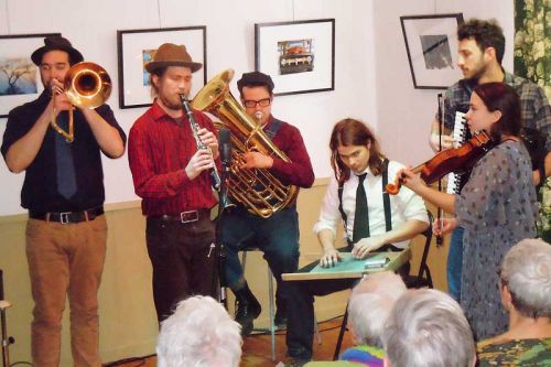 The Boxcar Boys l-r, Karl Silveira, John Williams, Nicolas Buligan, Justin Ruppel, Ronen Segall, and Laura C. Bates at their sold out show at the MERA Schoolhouse