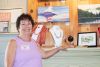 Judith Versavel poses with some of her artworks in between welcoming visitors to her gallery on the bay. Photo/Craig Bakay