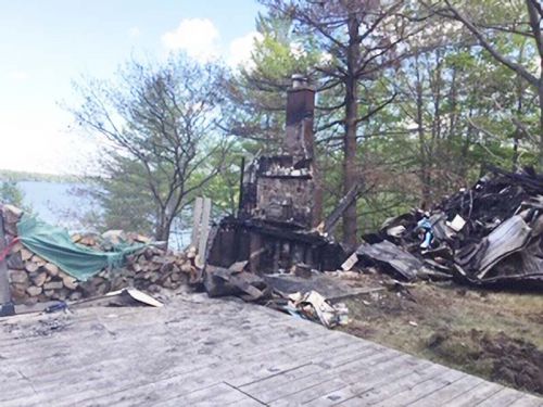 The chimney is all that is left of Kathleen White and Dave Whalen's home