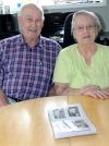 Eileen Whan and her husband Doug look over some old photos of Eileen and her pen pal Eileen. Photo/Craig Bakay