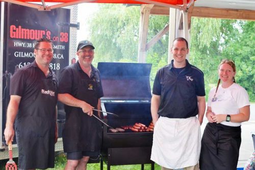 Staff from Gilmour's and Friendly Fires taking a very short break from feeding the hungry public at the annual fundraiser for Clothes for Kids.