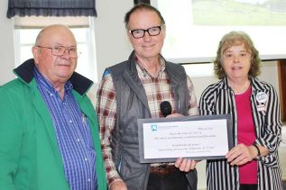 Coun. Gerry Martin and John Inglis presented Brenda Martin of the Clar-Miller Community Archives with a cheque for $6,650 from the Community Foundation for Kingston & Area to undertake the project Unravelling History: One Tombstone at a Time. The funds will be used to hire a summer student, Martin said. Photo/Craig Bakay