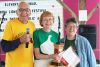 Garlic Guru Paul Pospisil and NFU president Dianne Dowling presented Dorothy Oogarah with the trophy as 2017 Champion at the 21st annual Eastern Ontario Garlic Awards Saturday in Verona. Photo/Craig Bakay