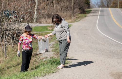 Sharon Maitland, left, and Jana Johnson, picking up garbage on the side of Perth Road at Norman Lane.