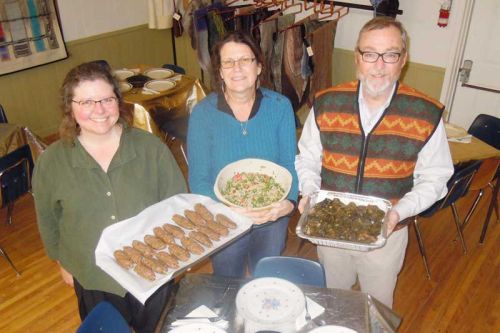 l-r Lyndal Neelin with Jan and Steve Griffiths serve up Lebanese food at MERA's popular Around the World on a Dinner Plate fundraiser