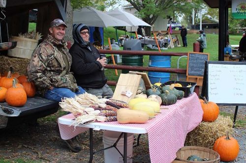 Ken Howes and Eric Zierer discuss their plans for the off season at the Sharbot Lake Farmers Market final gathering Saturday for 2018. Photo/Craig Bakay