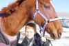 Brandon Heyman of Harrowsmith at home with Karazan, a 17-year-old mare he helped save from slaughter through NYNE