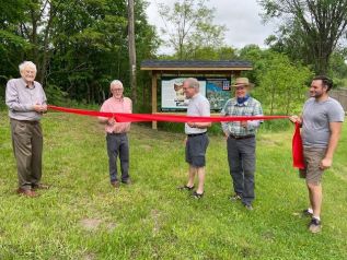 Left to right: Deputy Reeve Barrie Crampton, Reeve Brian Campbell, Jim Tysick (who helped name the park), Councillor Rob Rainer, and the son of Jim Tysick.