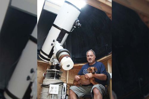 Gary Colwell has some new toys including a MallinCam system that is specially designed to take pictures that aren’t fuzzy. He’s pictured here at his home observatory with his new 12” telescope along with Bear, the cosmic dachshund. Photo/Craig Bakay