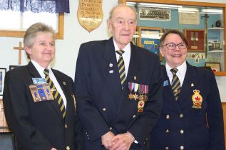 Second World War Veteran Norm Garney received his 30-year pin from 1st vice-president Patty Middleton and President June Crawford